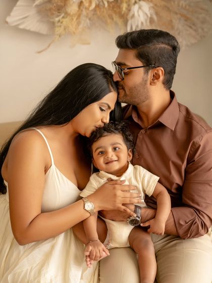 A phase of joy that cannot be forgotten. This beautiful family portrait captures the love and warmth between new parents and their baby.