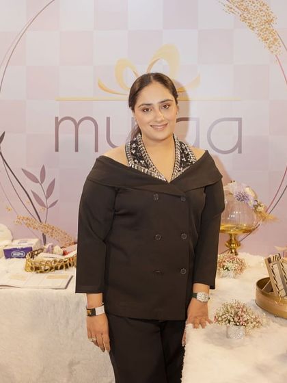 A photo of me at my exhibition stall at the WOW Awards, surrounded by my festive and wedding hampers.
