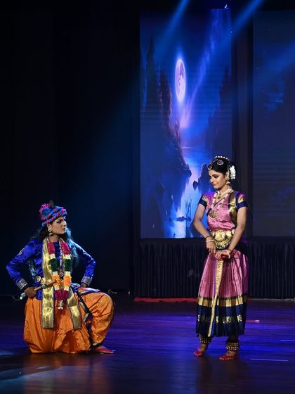 Krishna and Gopika in a moment of playful interaction. Our choreographies focus on bringing these divine stories to life with emotion and grace.