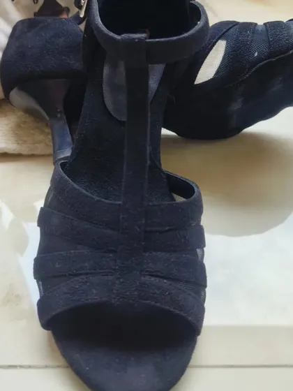 This top-down view showcases the classic open-toe silhouette and the quality of the black suede. It's a durable and comfortable shoe built to last through countless dances, from your first lesson to advanced socials.