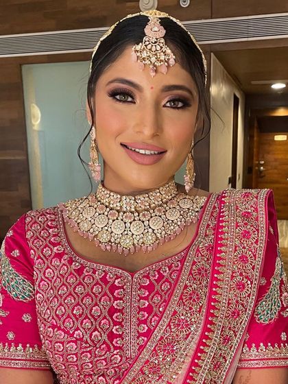 A close-up of the bride's beautiful smile and her elegant hairstyle.