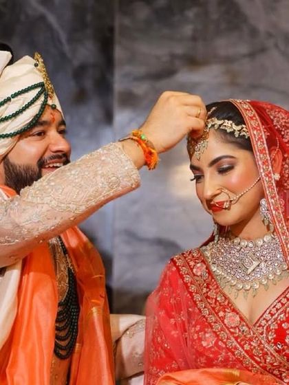 The sindoor moment for my beautiful bride Nitya. The groom's happy smile makes it even more special.