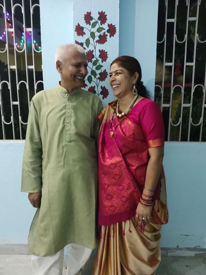 My parents posing in front of the simple floral mural I painted on a pillar at our family home.