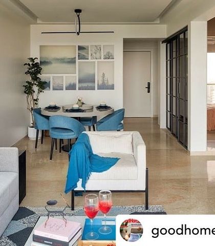 As featured in Good Homes Magazine, this apartment balances color and texture beautifully. The living area flows into the dining space, defined by a pop of blue in the chairs, creating clever pockets of function.