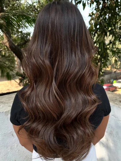 I call this look 'Hazelnut Chocolate Truffle'. It's a deep, rich brunette base with fine hazelnut highlights that add a subtle shimmer. This is a great option for anyone wanting to enhance their dark hair without a drastic change.