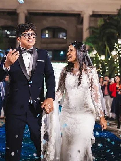 A joyful exit as the happy couple is showered with petals. Her makeup is designed to be long-lasting and picture-perfect throughout the entire celebration.