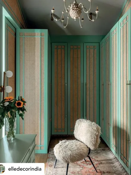 This walk-in wardrobe from 'Summer Haus' is a jewel box of color and texture. We used mint green cabinetry with cane insets and a fluffy statement chair to create a glamorous and highly personal dressing area that feels both playful and luxurious.