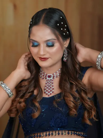 Another angle of the blue smokey eye, showing the beautiful blend of colors and the pearl hair accessories.