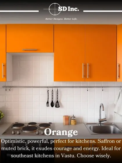 Orange is an energetic and optimistic color, perfect for a southeast-facing kitchen according to Vastu. This design uses bold orange cabinets to create a vibrant and courageous cooking space.