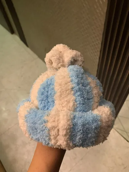 I made this super soft and cozy striped beanie for a one-year-old baby. I can make custom wearables like this for any age, perfect for a thoughtful baby shower gift.
