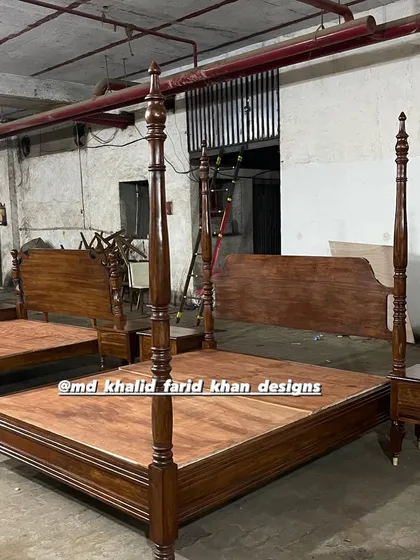 Another view of the four-poster beds, showing different headboard styles.