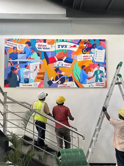 Here is the final mural installed at the TVS Motor Company office. This large-scale artwork serves as a permanent and powerful reminder of the team's shared values, transforming a simple staircase into a gallery of corporate identity and pride.