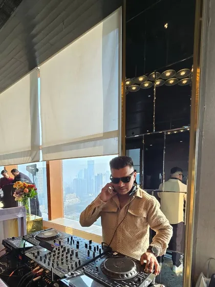 Taking a moment to listen to the mix on my headphones during a sundowner set. Every detail matters when it comes to creating the perfect sound.