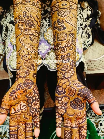 A detailed bridal design with the groom's name, Junaid, incorporated into the artwork.