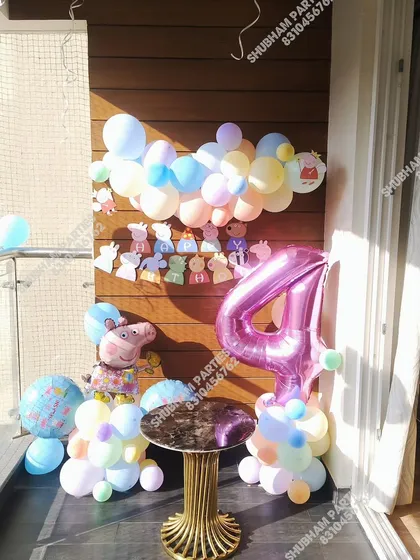 A Peppa Pig setup for a 4th birthday, perfect for a balcony or small space.