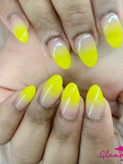 Bring a little sunshine to your fingertips with this cheerful yellow ombré. The color fades beautifully from a vibrant yellow at the tip to a soft, natural nude at the base, creating a fresh and happy vibe.