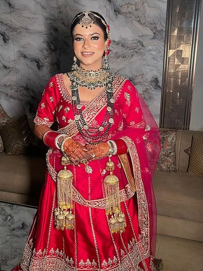 The complete bridal ensemble. Our client looks absolutely radiant in this traditional red lehenga, complete with kalire and stunning jewellery. We can help you put together your entire wedding look.