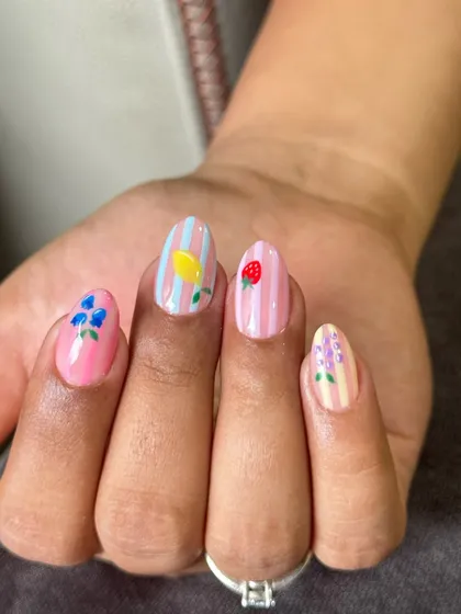 Another look at this adorable fruit salad nail set. The detail on the tiny blueberries and lavender sprigs shows how custom art can work beautifully on any nail length.