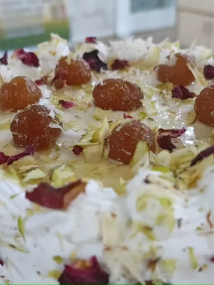 A beautiful Jamun cake, decorated with pistachios and rose petals. We teach not just the recipe but also the art of presentation to make your desserts look as good as they taste.