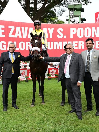 Baychmo, winner of The Five Star Shipping Million, poses with jockey A. Prakash and the proud owners.