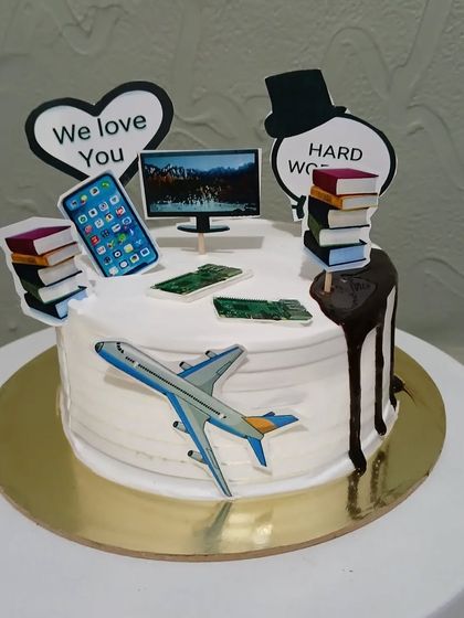 A cake that represents a busy life of work, travel, and technology.