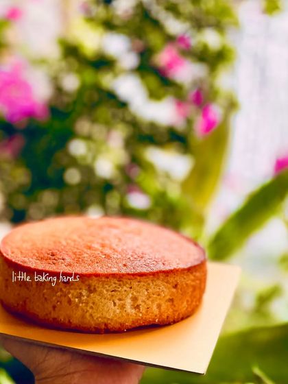 My French vanilla pound cake, held up against a beautiful floral background. It's a simple cake, but its flavour is anything but plain.