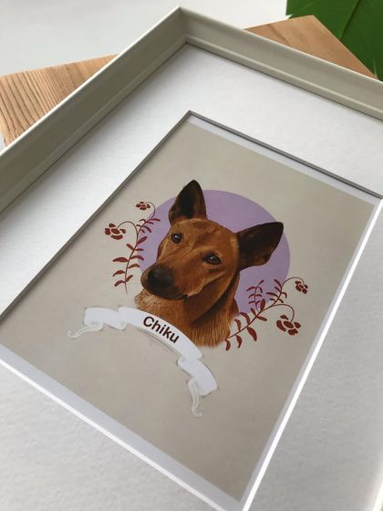 A detailed shot of the corner of the frame for Chiku's portrait. I ensure all frames are high quality to give your custom artwork a polished and lasting finish.