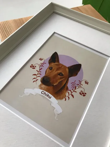 A detailed shot of the corner of the frame for Chiku's portrait. I ensure all frames are high quality to give your custom artwork a polished and lasting finish.