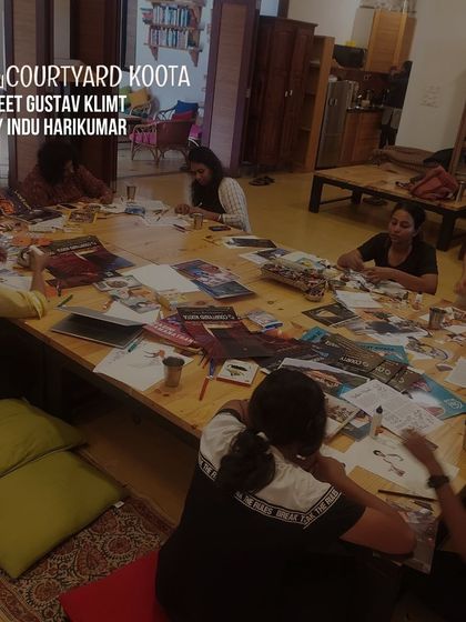 Participants deeply engaged in the creative process during the "Meet Gustav Klimt" self portrait workshop.