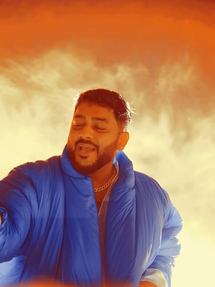 A stylized shot of artist Ritviz against a fiery backdrop. I use creative photography and editing to produce striking promotional content.