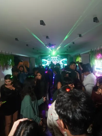 A wide shot of the party at The Vybe House, with lasers cutting through the room. I can bring a full production setup to elevate your event.