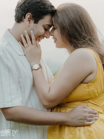 A beautiful close-up focusing on their happy, smiling faces. The soft focus on the background makes their connection the undeniable center of the photograph.