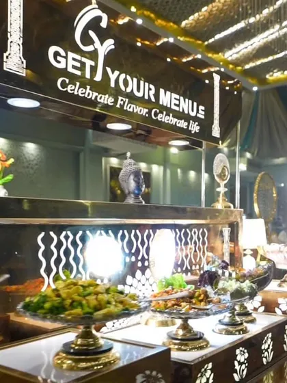 A wide view of one of our modern and elegant buffet counters, beautifully lit and ready for guests.