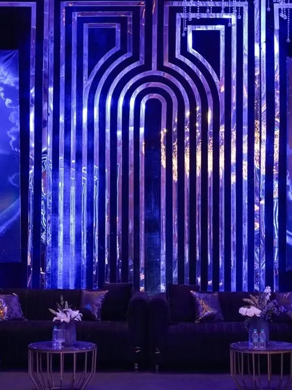 For this celestial-themed cocktail night, I designed a lounge backdrop with two glowing moons set against a cosmic sky, flanked by a modern, geometric mirrored panel.