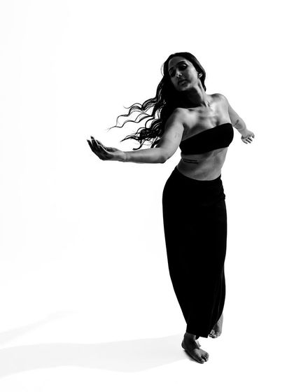 A soft, flowing pose captured in black and white, showing the gentle and lyrical side of my movement style.