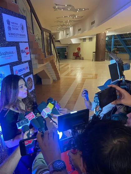 Surrounded by microphones and cameras at an awards night. As an artist, it is humbling to receive this attention and have a platform to talk about my passion.
