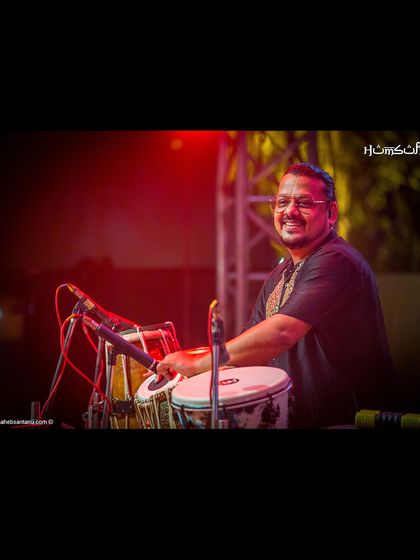 Our percussionist, smiling as he lays down the beat. The joy of music is contagious.