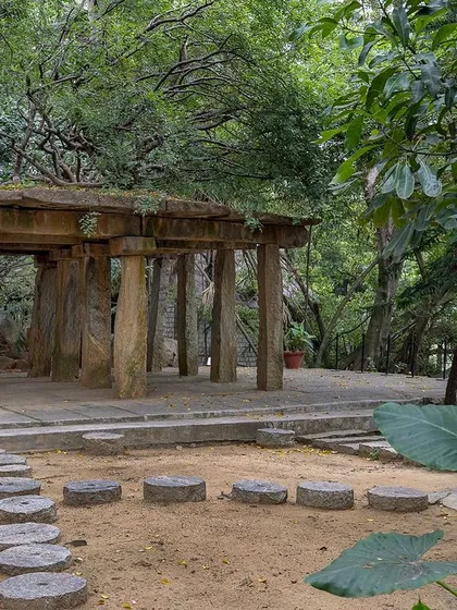The ancient Stone Mantapa, nestled in a quieter part of the garden, feels like a discovery. Its weathered stone pillars tell a story of centuries past.