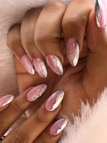 This design combines a sparkling pink glitter base with bold, abstract silver chrome accents. It's a perfect mix of glittery fun and modern edge.