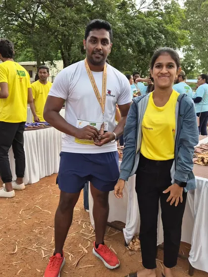 A post-race photo with a team member at the Mysuru Run. Celebrating another successful event together.