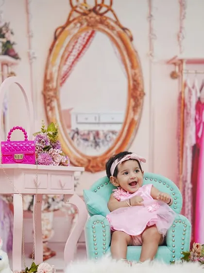 This wide shot shows the full, elaborate setup of our pink fashion closet theme, perfect for a stylish six-month celebration.
