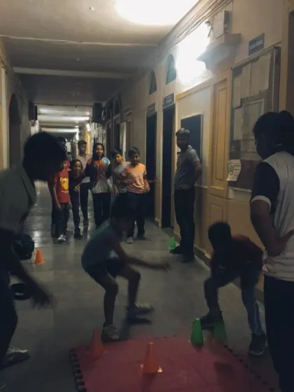 Training should also be fun. Here, students participate in an agility drill using cones, which improves their reaction time and coordination in an engaging way.