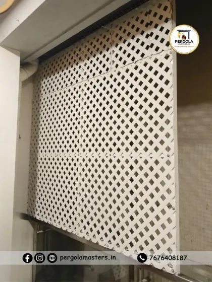 A straight-on view of the installed privacy lattice, highlighting the uniformity of the pattern and its effectiveness in obscuring the view into the area behind it.