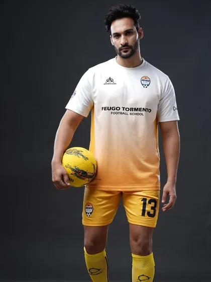 Sam in our academy's away kit. His journey is a perfect example of how our program helps you unlock your potential both on and off the pitch.