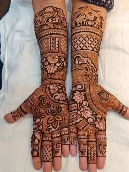 This full-hand design features a mix of peacocks, floral patterns, and jaali work. The symmetry and clean lines are a testament to the precision and care I put into every design.