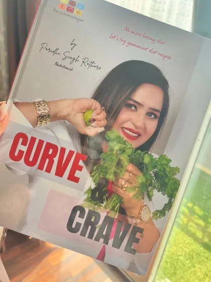 I am also the author of "Curve & Crave," a book filled with nutritionist approved diet recipes. Holding my book is a reminder that my goal is to make healthy, delicious food accessible to everyone.