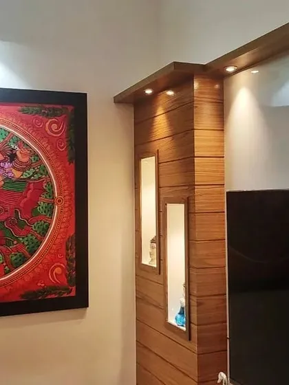 Another angle of the Ganesha painting, showing how it complements the home's modern wooden interior design.