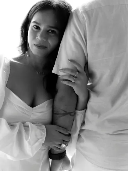 An intimate close-up that speaks volumes. The way she holds his arm and looks at the camera creates a feeling of trust and deep affection. These are the subtle moments that truly define a love story.