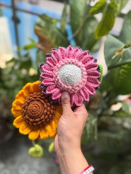 A side-by-side comparison of our classic yellow sunflower tie-back and the custom pink version. We can create these in any color to match your decor.