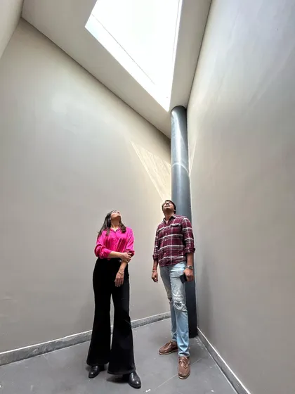 The co-founders looking up at a dramatic skylight in one of our projects. We love documenting our work and these on-site moments are special to us.